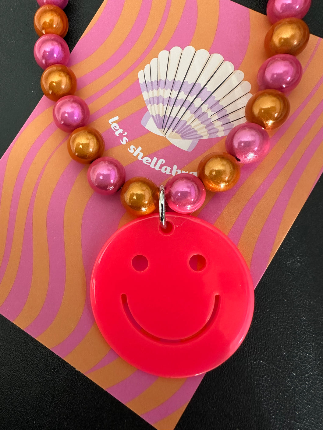 Smiley ketting roze oranje